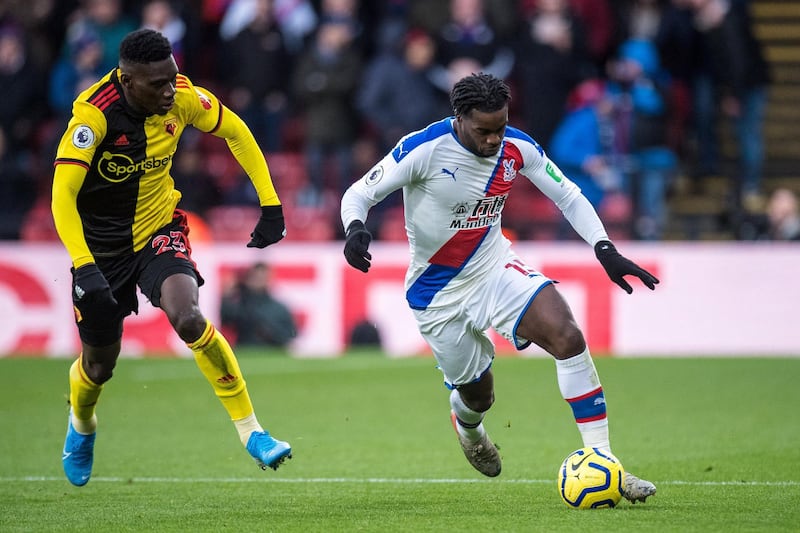 WATFORD, ENGLAND - DECEMBER 07: Ismaila Sarr of Watford FC and Jeffrey Schlupp of Crystal Palace during the Premier League match between Watford FC and Crystal Palace at Vicarage Road on December 7, 2019 in Watford, United Kingdom. (Photo by Sebastian Frej/MB Media/Getty Images)