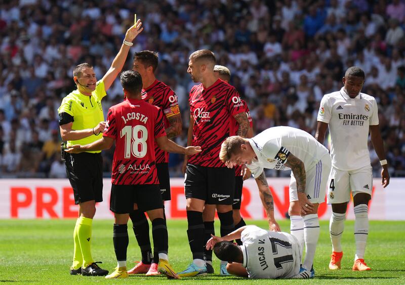 Referee Jorge Figueroa Vazquez shows Matija Nastasic of Mallorca a yellow card. Getty