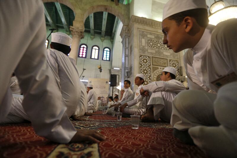 Syrians pray at the Umayyad Mosque in Damascus.