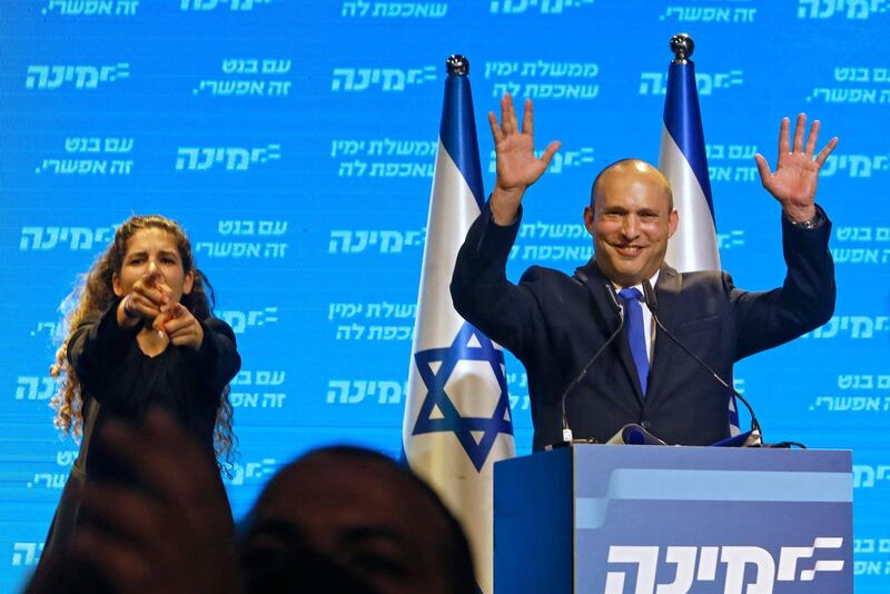 Naftali Bennett, leader of the Israeli right-wing Yamina party, addresses supporters at his party's campaign headquarters in the Mediterranean coastal city of Tel Aviv. AFP