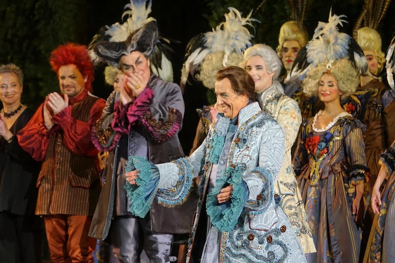 Italian baritone Leo Nucci bows after singing the title role in Rossiniâ€™s â€˜â€™Barbiere di Sivigliaâ€™â€™ at the Verona Arena, in Verona, Northern Italy, Saturday, Aug. 4, 2018. After the colossal Roman-era Verona Arena amphitheater lost audience and prestige, nearly closing two seasons ago under a mountain of debt, artists and public that have sustained it are putting hopes for a relaunch in 57-year-old former singer Cecilia Gasdia, in her first season as general manager. (AP Photo/Martino Masotto)