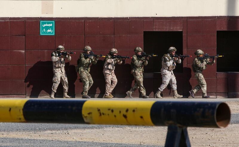 Kuwaiti and British soldiers take part in the Exercise Desert Warrior, attended by Prince William, Duke of Cambridge (unseen), at Sheikh Salem al-Ali al-Sabah Camp, about 40 kilometres north of Kuwait City.  AFP