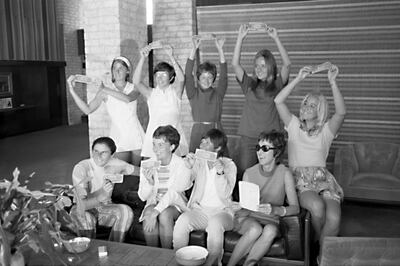 In this Sept. 23, 1970, photo provided the Houston Library, tennis players hold up $1 bills after signing a contract with World Tennis magazine publisher Gladys Heldman to turn pro and start the Virginia Slims tennis circuit. From left standing are: Valerie Ziegenfuss, Billie Jean King, Nancy Richey and Peaches Bartkowicz. From left seated are: Judy Tegart Dalton, Kerry Melville Reid, Rosie Casals, Gladys Heldman and Kristy Pigeon. Gladys Heldman replaced her daughter, Julie Heldman, who was injured and unable to pose for the 1970 photo.  Itâ€™s the 50th anniversary of Billie Jean King and eight other women breaking away from the tennis establishment in 1970 and signing a $1 contract to form the Virginia Slims circuit. That led to the WTA Tour, which offers millions in prize money. (Bela Ugrin/Courtesy Houston Library via AP)