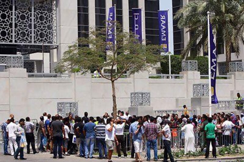 People who queued for hours outside Emaar's sales office in the hopes of buying property had to be dispersed by police after huge queues caused chaos. Satish Kumar / The National