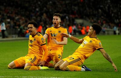 Soccer Football - Premier League - Tottenham Hotspur v Wolverhampton Wanderers - Wembley Stadium, London, Britain - December 29, 2018  Wolverhampton Wanderers' Helder Costa celebrates with Matt Doherty and Morgan Gibbs-White  after scoring their third goal    Action Images via Reuters/Paul Childs  EDITORIAL USE ONLY. No use with unauthorized audio, video, data, fixture lists, club/league logos or "live" services. Online in-match use limited to 75 images, no video emulation. No use in betting, games or single club/league/player publications.  Please contact your account representative for further details.