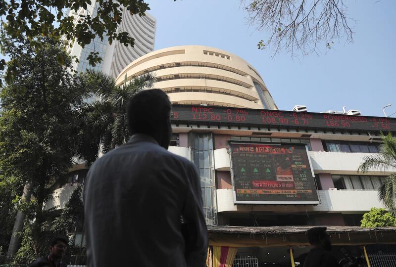 A man watches the stock exchange index on a display screen on the facade of the the Bombay Stock Exchange (BSE) building in Mumbai, India, Saturday, Feb. 1, 2020. Indiaâ€™s Hindu nationalist-led government on Saturday offered relief to taxpayers and vowed to spend billions to double farmersâ€™ incomes, upgrade infrastructure, health care and industry to boost the lowest economic growth in a decade. (AP Photo/Rafiq Maqbool)