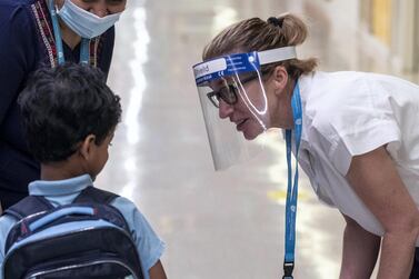 Pupils return to Gems Wellington Academy in Al Khail for the start of the school year on Sunday. Antonie Robertson / The National