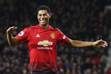(FILES) In this file photo taken on December 08, 2018 Manchester United's English striker Marcus Rashford celebrates after scoring during the English Premier League football match between Manchester United and Fulham at Old Trafford in Manchester, north west England, on December 8, 2018. Manchester United footballer Marcus Rashford said on Wednesday he would keep fighting to help low-income families after his campaign forced the British government to change its policy on providing free school meals for the poorest children. - RESTRICTED TO EDITORIAL USE. No use with unauthorized audio, video, data, fixture lists, club/league logos or 'live' services. Online in-match use limited to 120 images. An additional 40 images may be used in extra time. No video emulation. Social media in-match use limited to 120 images. An additional 40 images may be used in extra time. No use in betting publications, games or single club/league/player publications. / AFP / Paul ELLIS / RESTRICTED TO EDITORIAL USE. No use with unauthorized audio, video, data, fixture lists, club/league logos or 'live' services. Online in-match use limited to 120 images. An additional 40 images may be used in extra time. No video emulation. Social media in-match use limited to 120 images. An additional 40 images may be used in extra time. No use in betting publications, games or single club/league/player publications.
