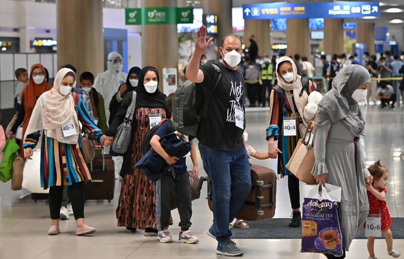 Afghan evacuees arrive at Incheon International Airport outside Seoul following their departure from Kabul via Pakistan. AFP
