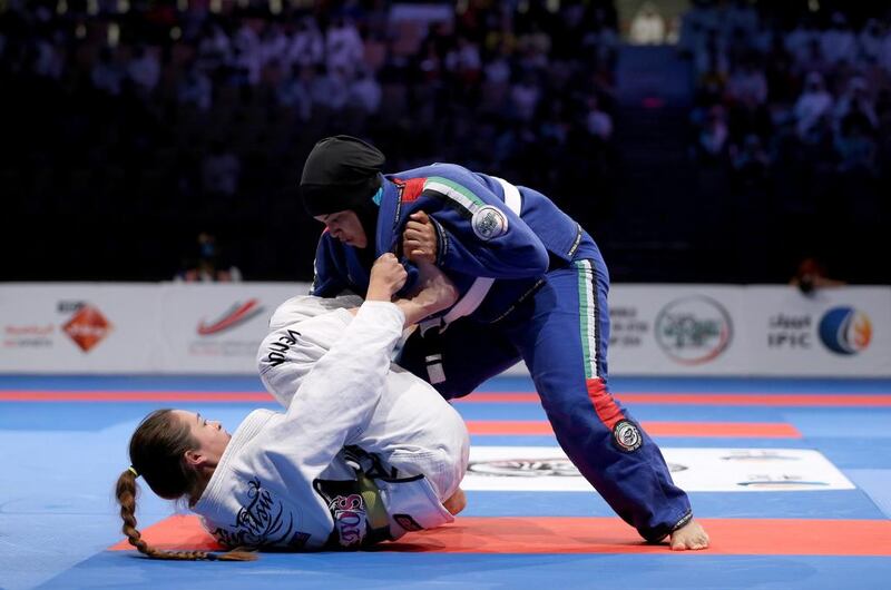 The Emirati Shefaa Moosa Hassan competes with Amelia Lui of Great Britain in the women's white belt open weight finals during the Abu Dhabi World Professional Jiu-Jitsu Championship at First Gulf Bank Arena. Francois Nel / Getty Images