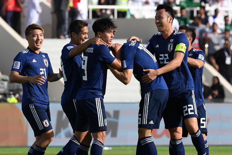 Japan players celebrate. EPA