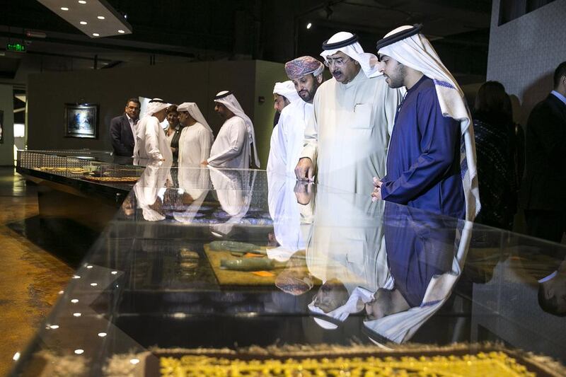 Visitor admire the objects on display at the newly opened ‘Miraj - The Museum’. Silvia Razgova / The National