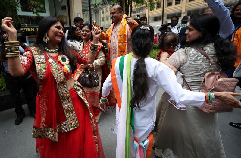 Supporters dance ahead of the arrival of Mr Modi in New York. Reuters