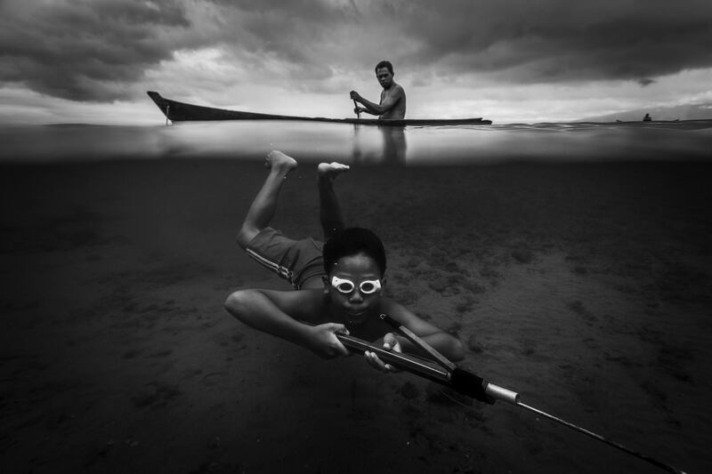 Third prize of this year's 'Water' category goes to 'Octopus Hunter' by Buchari Muslim Diken. It  is a portrait of a child in search of octopus along the coast of a fishing village in Ambon, the Maluku Islands.  Buchari Muslim Diken