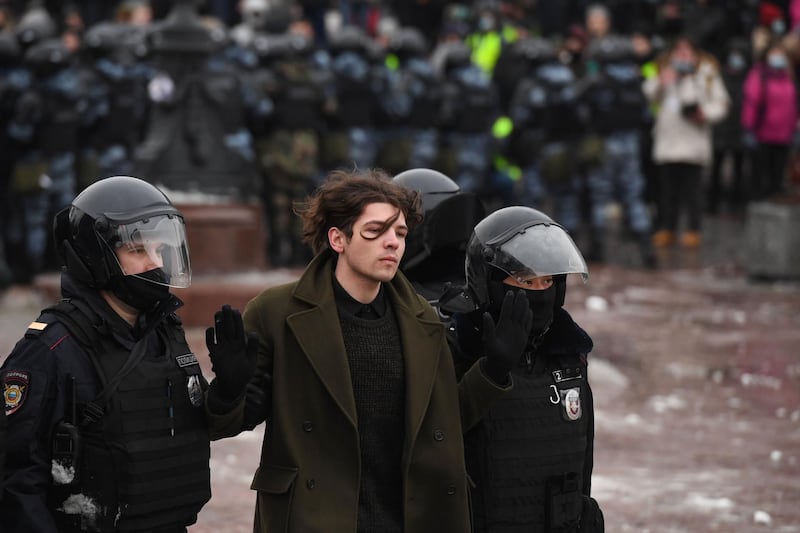 Police detain a protester during a rally in support of jailed opposition leader Alexei Navalny in downtown Moscow on January 23. AFP