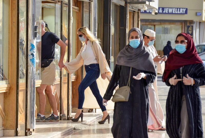 Shoppers walk past jewellery shops in the Tiba gold market in the capital Riyadh.   AFP