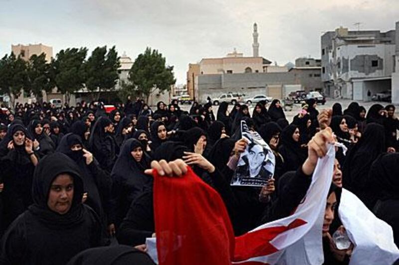 Protesters march in Sitra after the funeral of a teenager who was killed when he was hit by a police vehicle, said by the government to be an accident. The demonstrators were later confronted by riot police.