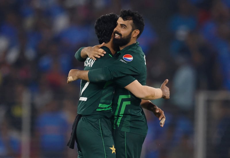 Pakistan's Hasan Ali celebrates with Shadab Khan after taking the wicket of India's Virat Kohli, caught by Mohammad Nawaz. Reuters