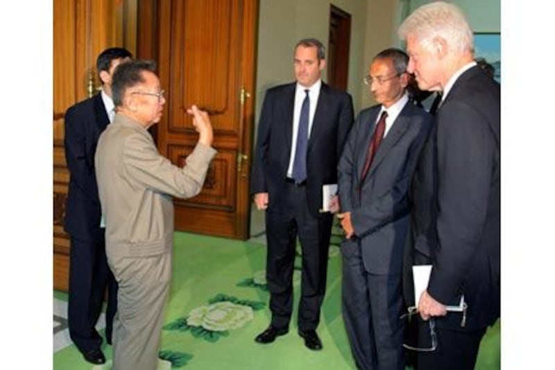 Former US president Bill Clinton in August with Kim Il Jong, left - or is it?.