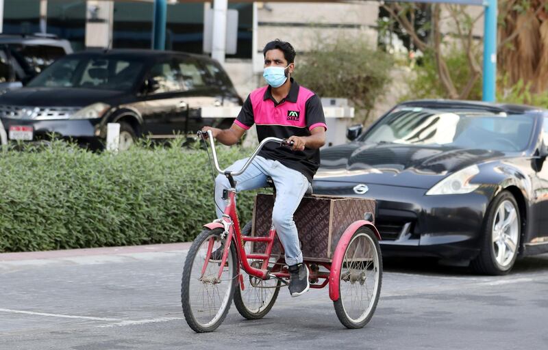 DUBAI, UNITED ARAB EMIRATES , September 14 – 2020 :- A delivery man wearing protective face mask as a preventive measure against the spread of coronavirus at the Barsha heights in Dubai.  (Pawan Singh / The National) For News/Stock