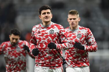 Manchester United's Harry Maguire (C) warms up for the English Premier League match between Newcastle United and Manchester United in Newcastle, Britain, 27 December 2021.   EPA/PETER POWELL EDITORIAL USE ONLY.  No use with unauthorized audio, video, data, fixture lists, club/league logos or 'live' services.  Online in-match use limited to 120 images, no video emulation.  No use in betting, games or single club / league / player publications