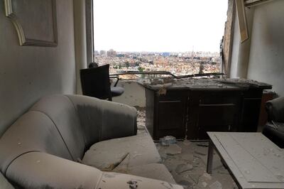 This photo released by the Syrian official news agency SANA, shows damage inside a office that was hit by shelling, apparently by Islamic State fighters, in Damascus, Syria, Wednesday, May 9, 2018. Militants fired three mortar shells on the center of Damascus Wednesday killing several persons and wounding 14, Syria's state news agency said. (SANA via AP)
