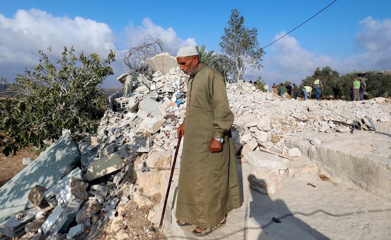 A man walks past the rubble of the home of Mohammed Youssef after it was demolished by Israeli troops in the village of Kobar near Ramallah, in the occupied West Bank. Reuters