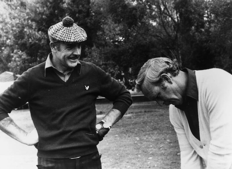 15th October 1976:  Film star Sean Connery gets a few tips from American golfer Arnold Palmer, his partner in a Pro-Am tournament in Paris.  (Photo by Central Press/Getty Images)