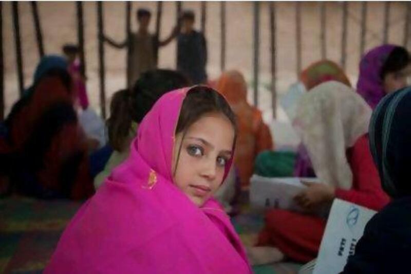 Students at Pehli Kiran School 7 at the Royal Colony settlement near Islamabad. Girls make up half the pupils in some classes, with the school's closeness to the village encouraging families to let them attend. Courtesy Rebecca Conway
