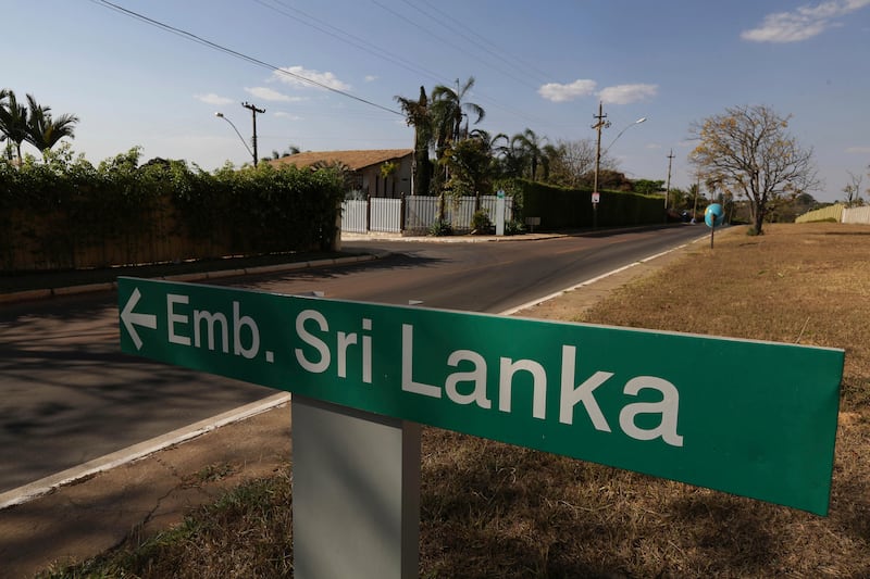 A sign points out the location of the Sri Lanka embassy in Brasilia, Brazil, Monday, Aug. 28, 2017. Human rights groups in South America are alleging war crimes violations in lawsuits filed against a former Sri Lankan general who is now his Asian nation��������s ambassador to Brazil and five other countries in Latin America. (AP Photo/Eraldo Peres)