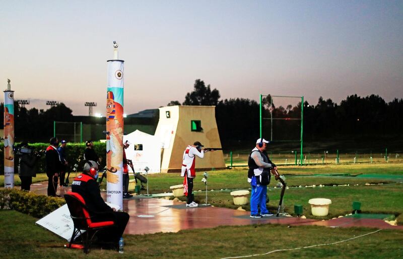 Competitors in action during the men's trap at the ISSF World Cup in Cairo. Reuters