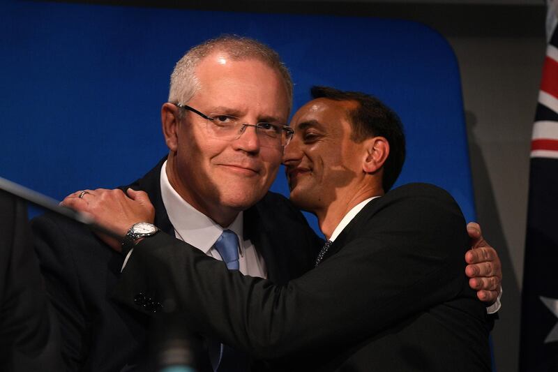 epa07106423 Australian Prime Minister Scott Morrison (L) embraces Liberal candidate Dave Sharma prior to his concession speech, at the Liberal Party Wentworth by-election function in Double Bay, Sydney, Australia, 20 October  2018. Independent candidate Kerryn Phelps has won the seat from the Liberal Party in today's by-election, triggered after Malcolm Turnbull quit the seat when deposed as prime minister.  EPA/DAN HIMBRECHTS  AUSTRALIA AND NEW ZEALAND OUT
