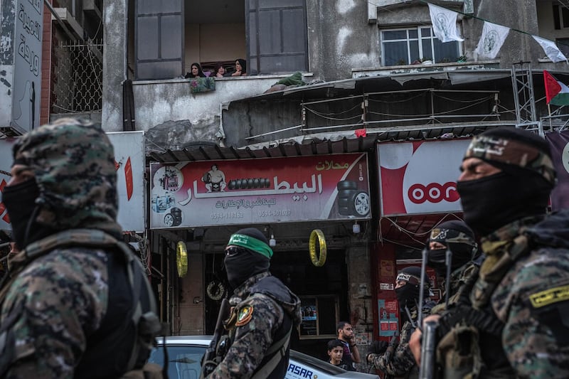 Fighters of Ezz al-Din Al-Qassam brigades, the military wing of Hamas, march in greeting to the Al Qassam commanders in Gaza Basim Issa in Gaza City in Gaza City, Gaza. The ceasefire between Israel and Hamas appeared to be holding, despite fresh clashes at Al-Aqsa Mosque in East Jerusalem. The ceasefire brings to an end eleven days of fighting which killed more than 250 Palestinians, many of them women and children, and 13 Israelis. The conflict began on May 10th after rising tensions in East Jerusalem and clashes at the Al Aqsa Mosque compound. Getty Images