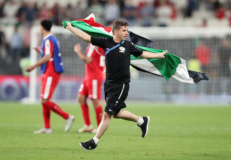 A member of the Palestine coaching staff after the match. Reuters