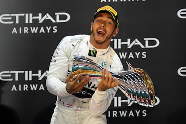 World champion Lewis Hamilton celebrates on the podium after his brilliant win in Abu Dhabi in 2019. Getty