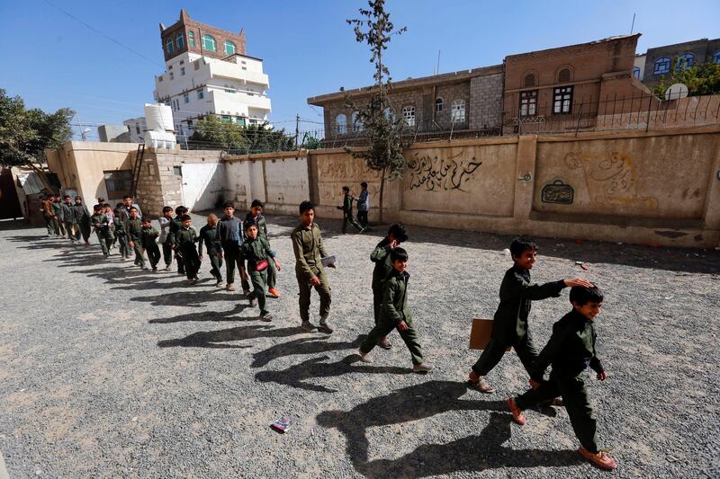 Schoolchildren gather to take a midterm school exam at a public school in Sana'a, Yemen.  EPA