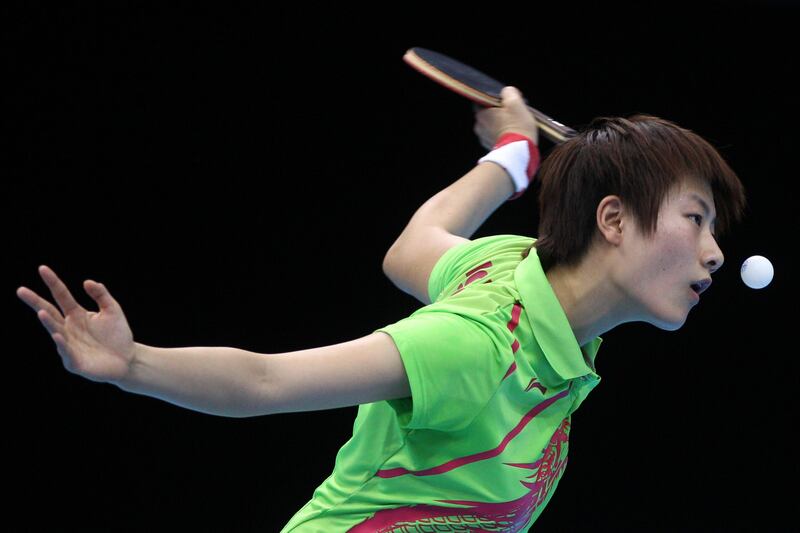 LONDON, ENGLAND - JULY 30:  Ning Ding of China eyes the ball during her Women's Singles Table Tennis fourth round match against Huajun Jiang of Hong Kong, China on Day 3 of the London 2012 Olympic Games at ExCeL on July 30, 2012 in London, England.  (Photo by Feng Li/Getty Images)