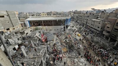 Palestinians inspect the site of an Israeli strike on houses in Jabalia refugee camp, in northern Gaza. Reuters