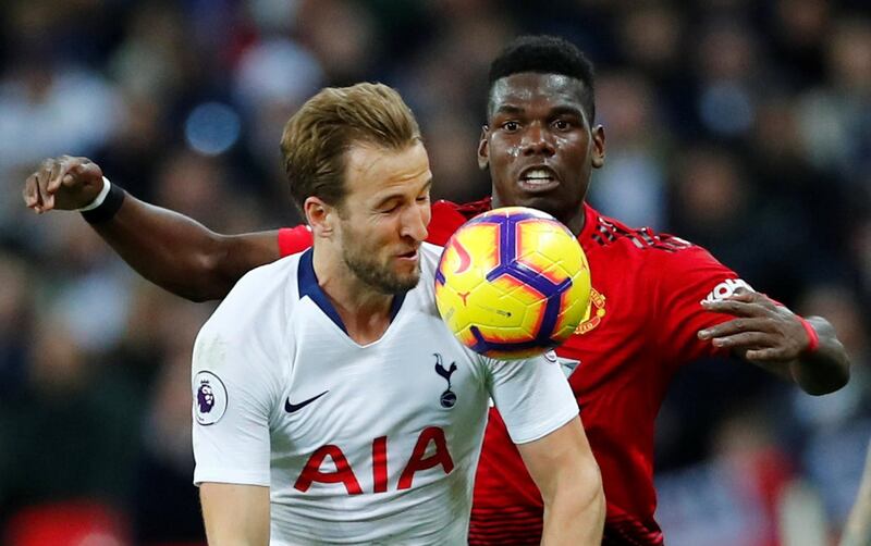 Kane in action with Manchester United's Paul Pogba. Reuters