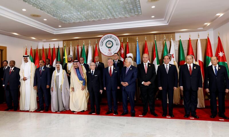 Leaders pose for the camera ahead of the 30th Arab Summit in Tunis, Tunisia. Reuters