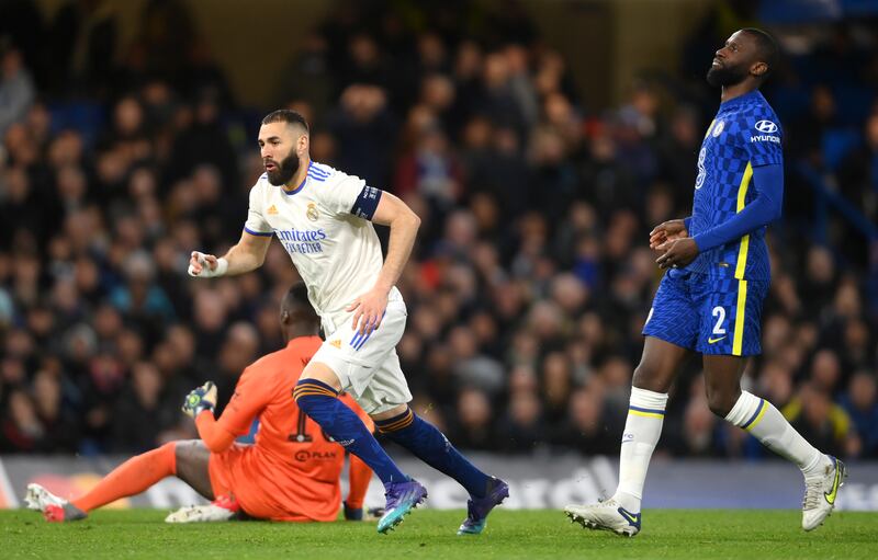 Real's Karim Benzema celebrates his hat-trick after woeful defending from Chelsea. Getty