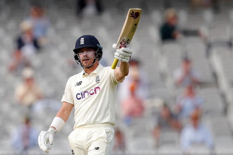 England's Rory Burns celebrates reaching his half century. Reuters