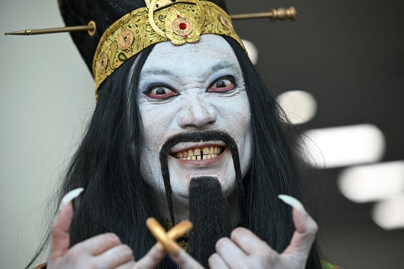 A cosplayer portrays the character Lo-Pan from 'Big Trouble In Little China' outside the convention center during San Diego Comic-Con 2022, California. AFP