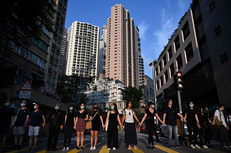 Students and teachers take part in a joint ‘school human chain rally’ in Hong Kong.   AFP