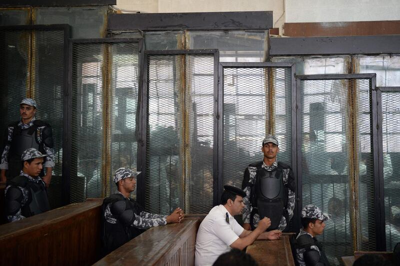 The courtroom and soundproof glass dock is seen during the trial of 700 defendants including Egyptian photojournalist Mahmoud Abu Zeid, widely known as Shawkan, in the capital Cairo. AFP