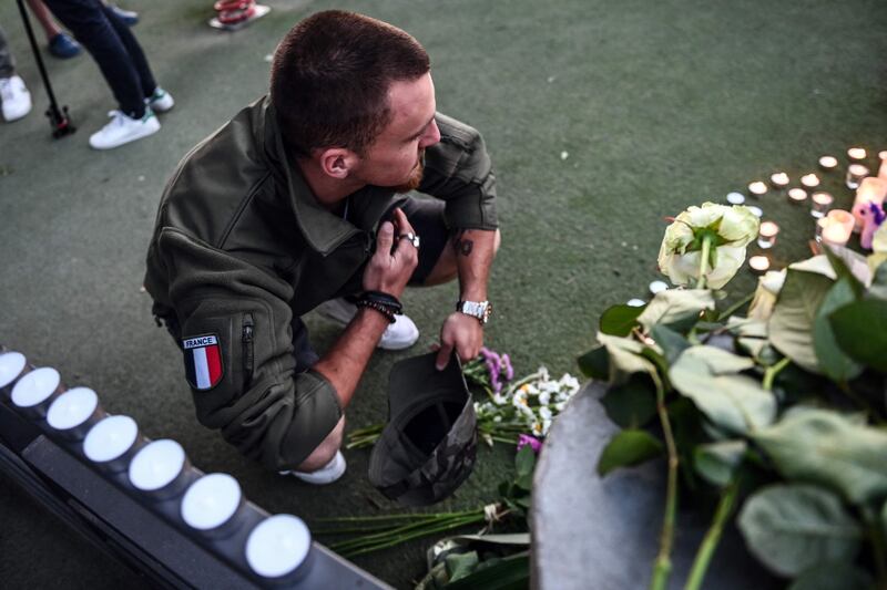 A man by a makeshift memorial at the playground. AFP