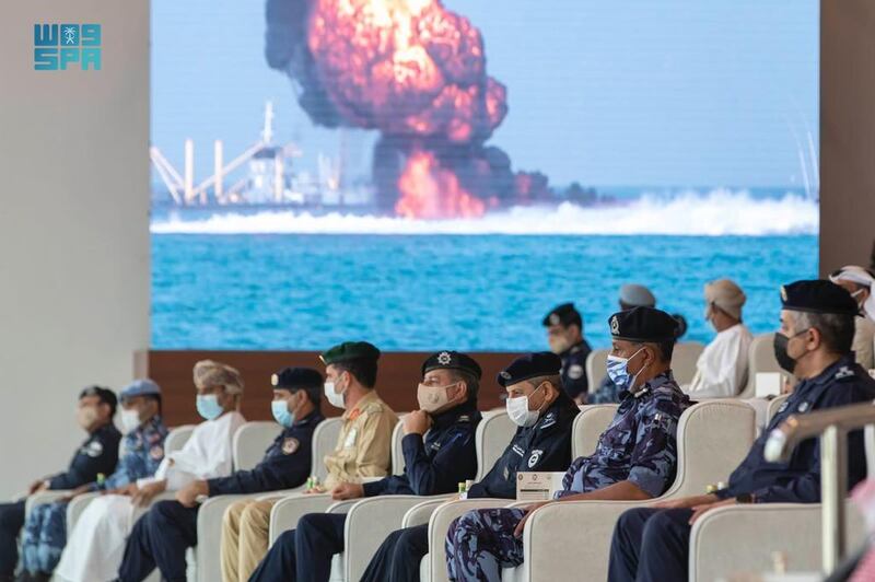 Police and military officers observe a mock attack on a port facility. Photo: SPA