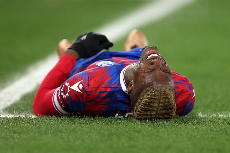 Wilfried Zaha of Crystal Palace goes down with an injury. Getty