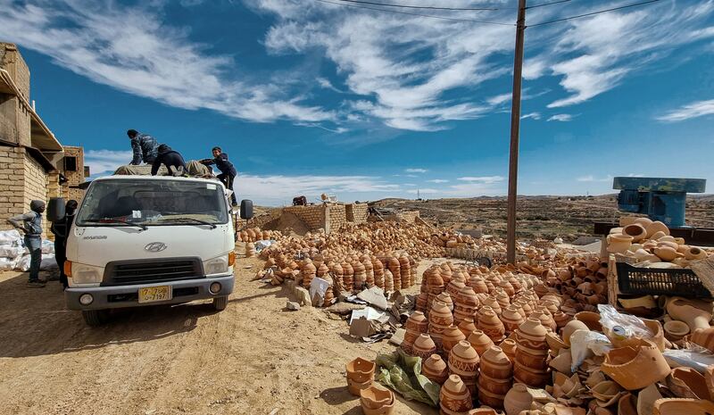 Ceramic pots are loaded on to a truck in Gharyan, Lebanon where dwindling demand is forcing potters to seek new markets online. AFP