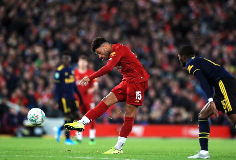 Liverpool's Alex Oxlade-Chamberlain scores his side's third goal. PA